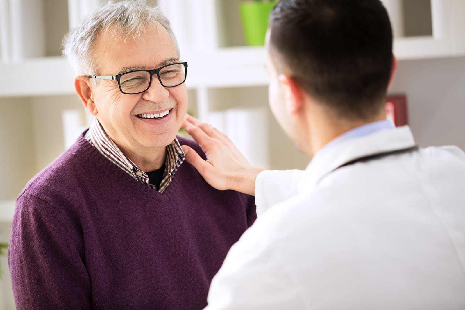 RuralHealthCareLandscape A provider pats the shoulder of smiling patient