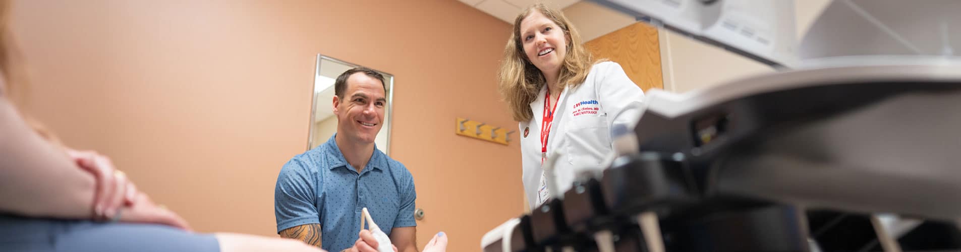 Dr. Kroll uses an ultrasound machine to examine a patient's foot