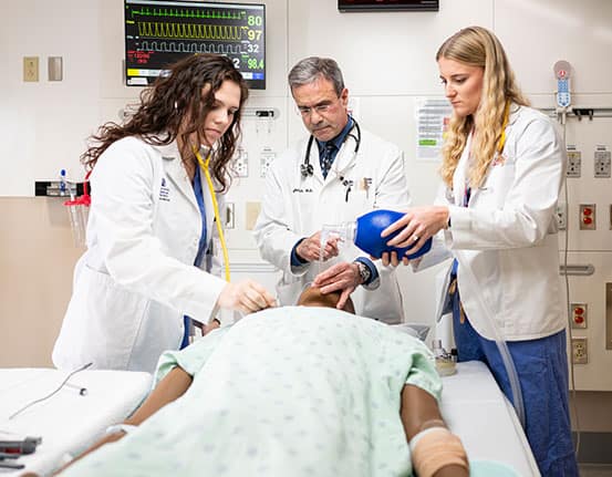 MedicalStudentScholarships A rheumatologist examines hand joints on an x-ray