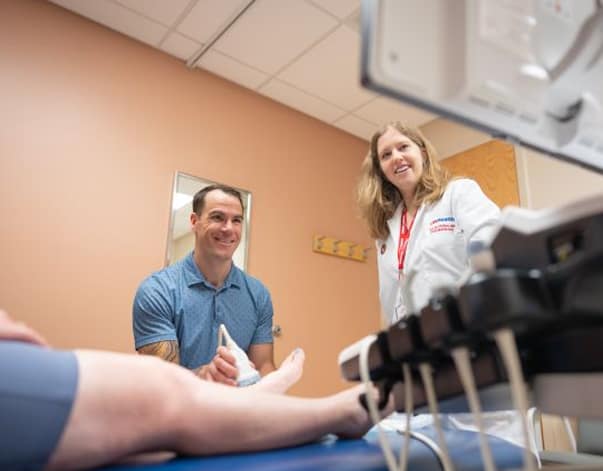 Dr. Brian Kroll of The Richland Hospital and Clinics uses an ultrasound to examine a patient.